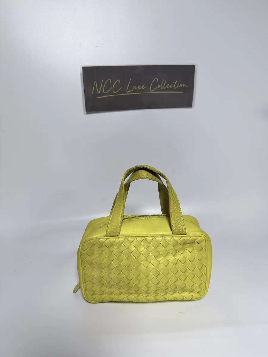the Bottega Veneta  Intrecciato Nappa Leather Top-Handle Bag or Mini Bauletto Bag
